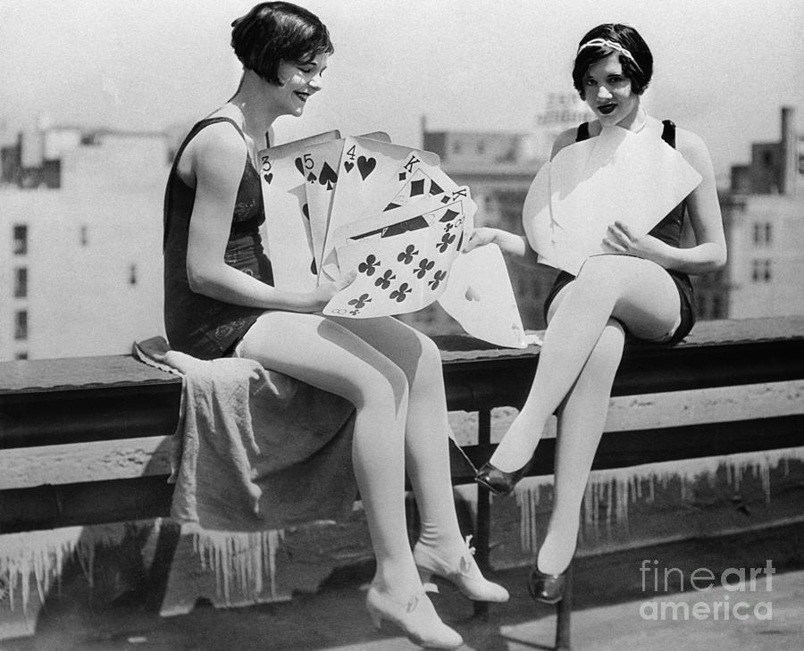 Yong Smiling Women Playing Big Cards Photograph by Bettmann