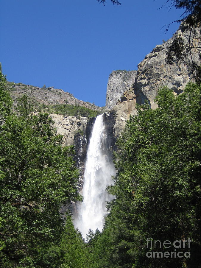 Yosemite National Park Bridal Veil Falls Water Fall Blast on a Blue Sky Day Photograph by John Shiron