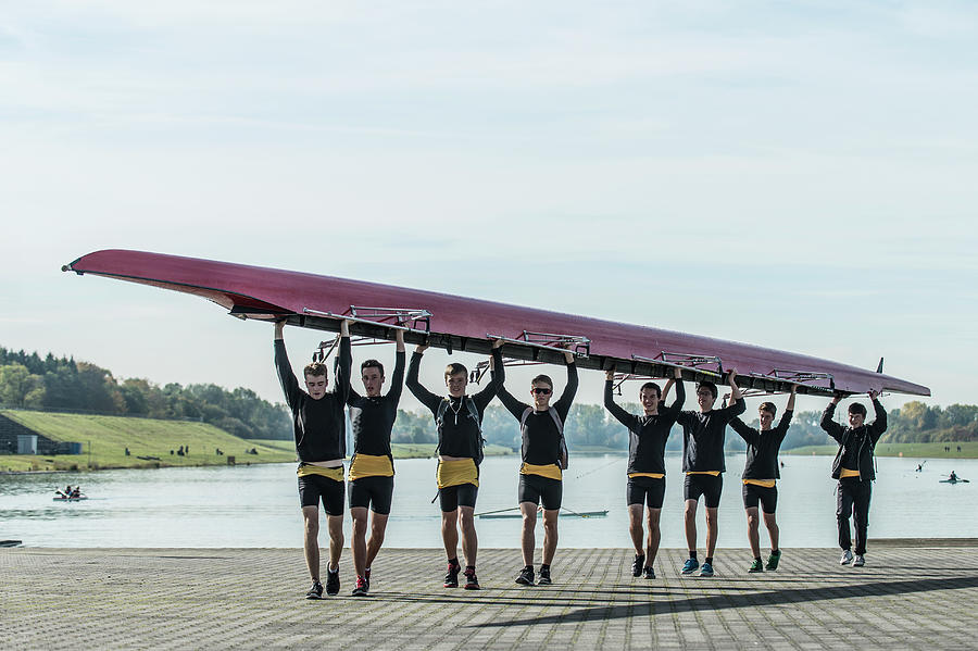 Young Athletes Carrying A Crew Row Boat Photograph by Bernhard Lang