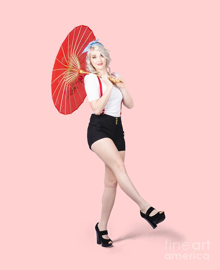 Young beautiful pin up woman posing with umbrella Photograph by Jorgo Photography