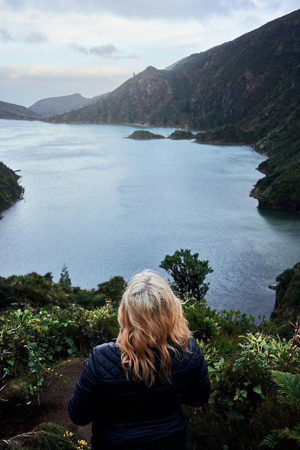 Nature Photograph - Young Blonde Woman Observing The Lake do Fogo Of Sao Miguel, Azores by Cavan Images