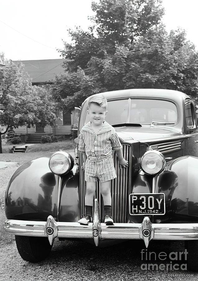 Young Boy On Front Bumper Of 1937 Packard Photograph by Retrographs