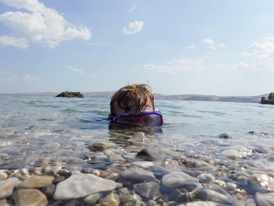 Young Boy Swimming In Shallow Water Off The Coast Of Croatia Photograph ...