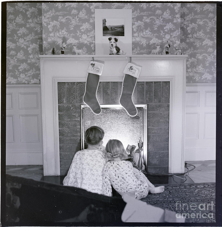 Young Brother And Sister By Fireplace Photograph by Bettmann