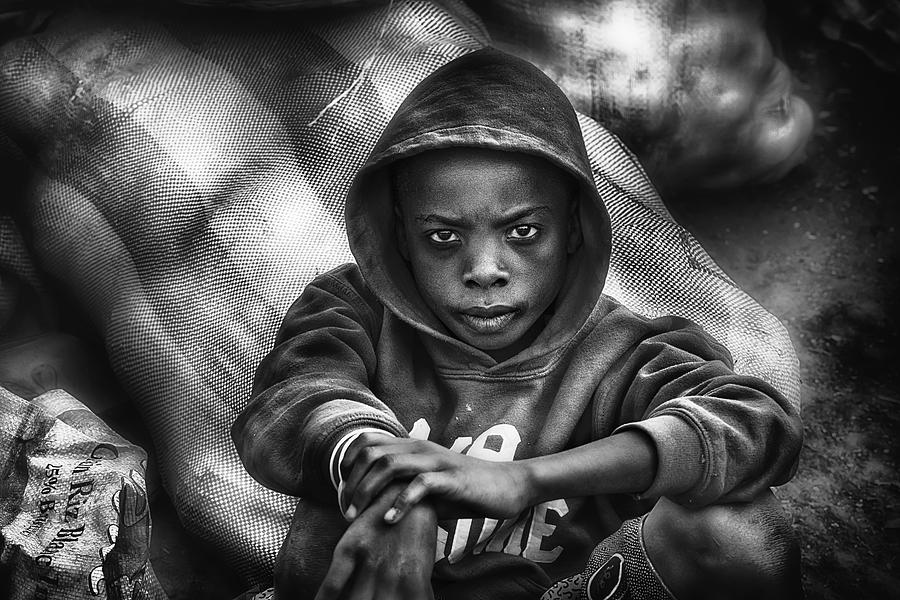 Street Photograph - Young Coal Seller - Cote Divoire by Sergio Pandolfini