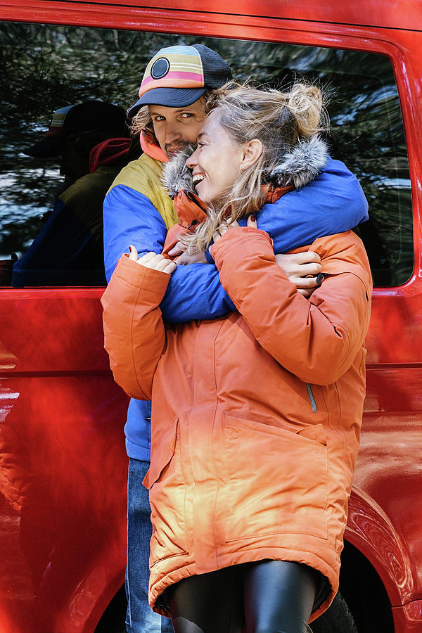 Transportation Photograph - Young Couple Hugging Outside A Red Campervan Ready To Travel. Adventur by Cavan Images