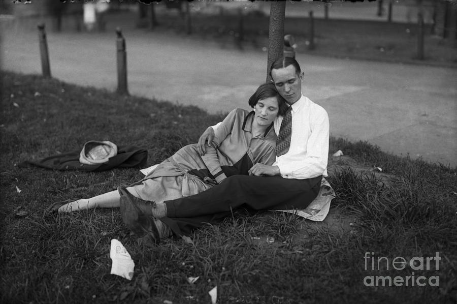 Young Couple Resting In Park Photograph by Bettmann