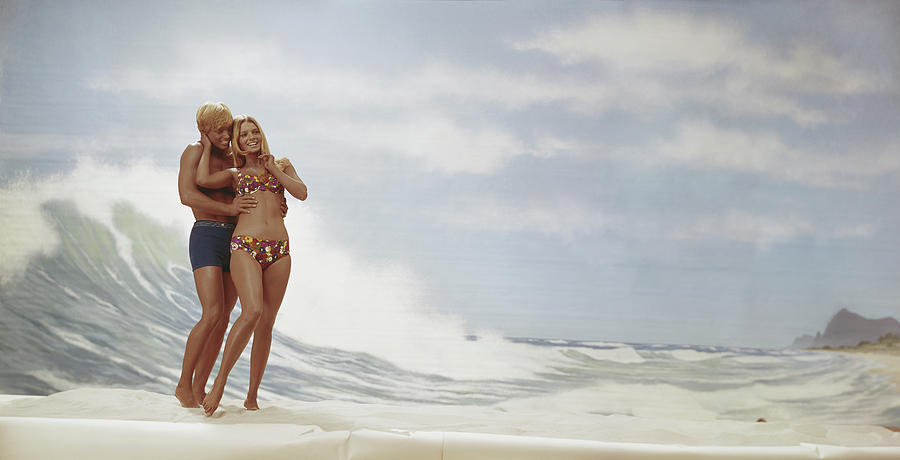 Young Couple Standing On Beach, Smiling Photograph by Tom Kelley Archive