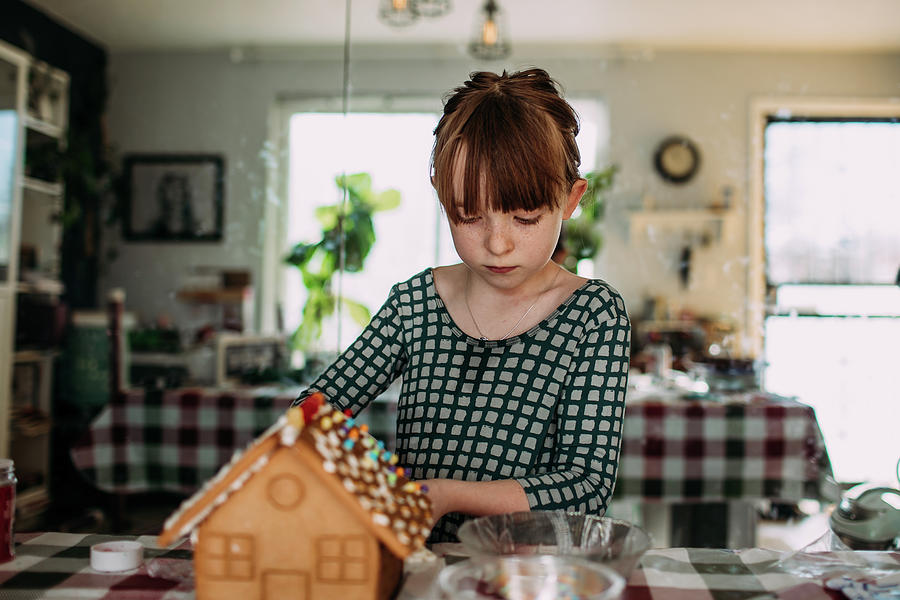 Young Girl Decorating A Gingerbread House Inside Photograph by Cavan ...