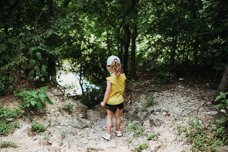 Spring Photograph - Young Girl Hiking Near Barton Springs And Looking At Water by Cavan Images