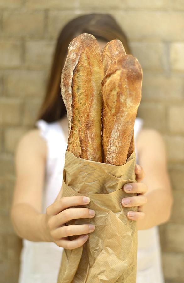 Young Girl Holding 3 Baguettes Photograph by Keroudan