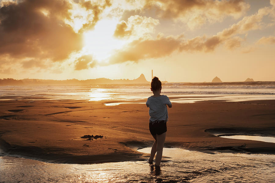 Young Girl On Beach Taking Selfie During Sunset Photograph by Cavan ...