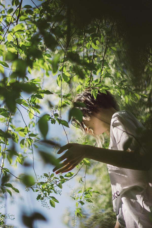 Young Girl Standing Under A Tree On A Sunny Day Photograph by Cavan ...