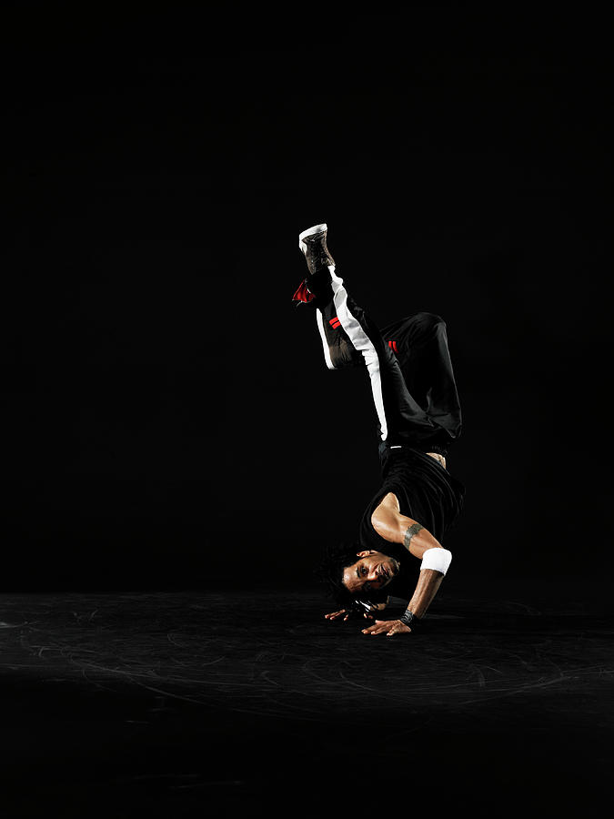 Young Male Breakdancer Doing Handstand Photograph by Thomas Barwick