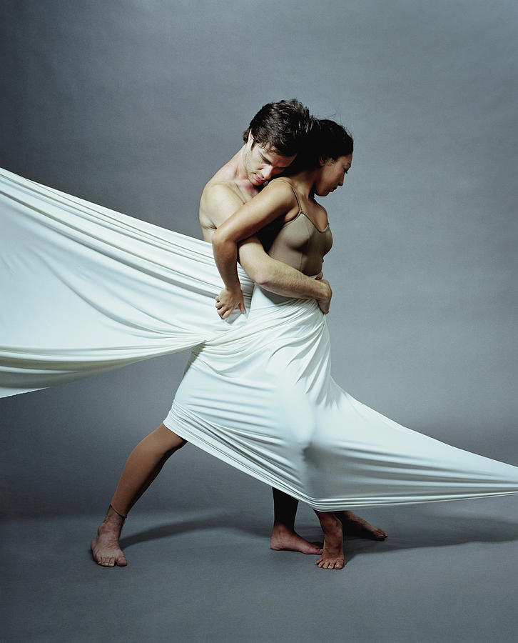 Young Man And Woman Embracing, Wrapped Photograph by Pm Images