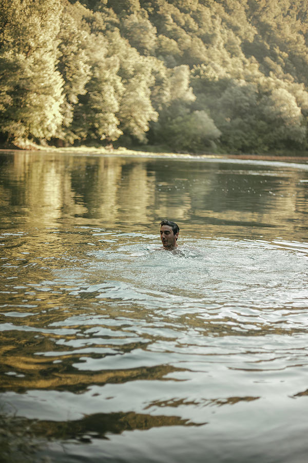Nature Photograph - Young Man Bathing In The River by Cavan Images