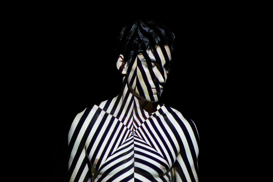 Young Man Covered By Abstract Patterns Photograph by Mads Perch