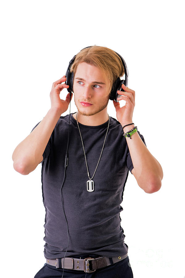 Young Man Listening To Music With Headphones Photograph