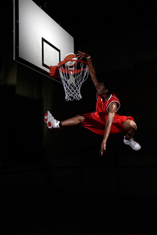 Young Man Making A Fancy Dunk Photograph by Compassionate Eye Foundation/steve Coleman/ojo Images Ltd
