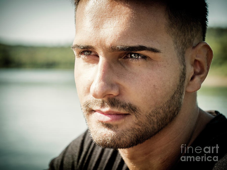 Young man standing in water in sea or lake Photograph by Stefano C ...