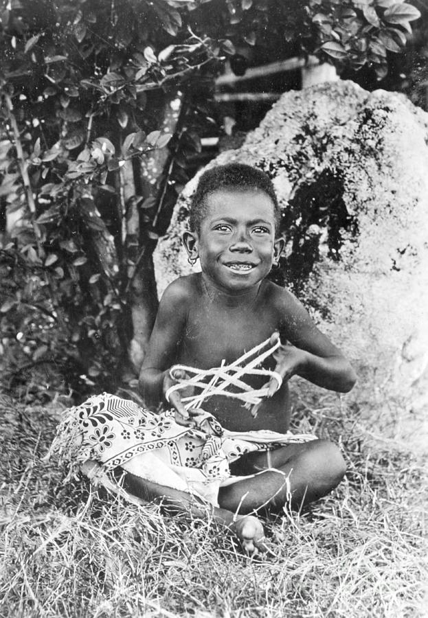 Young New Guinea Boy Playing With String Photograph by Bettmann