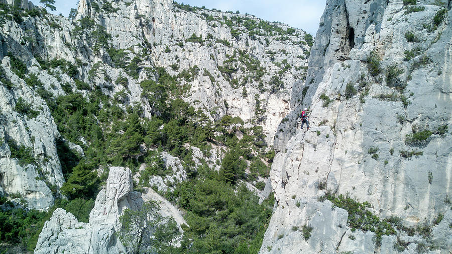 Young People Climbing A Rock Formation In The South Of France ...