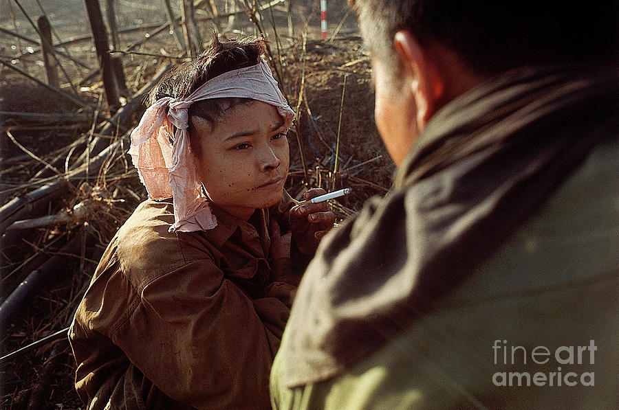 Portrait Photograph - Young Viet Cong Prisoner Smoking by Bettmann