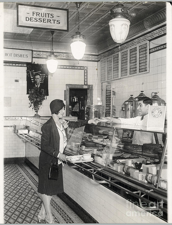 Young Woman Being Served At Cafeteria Photograph by Bettmann