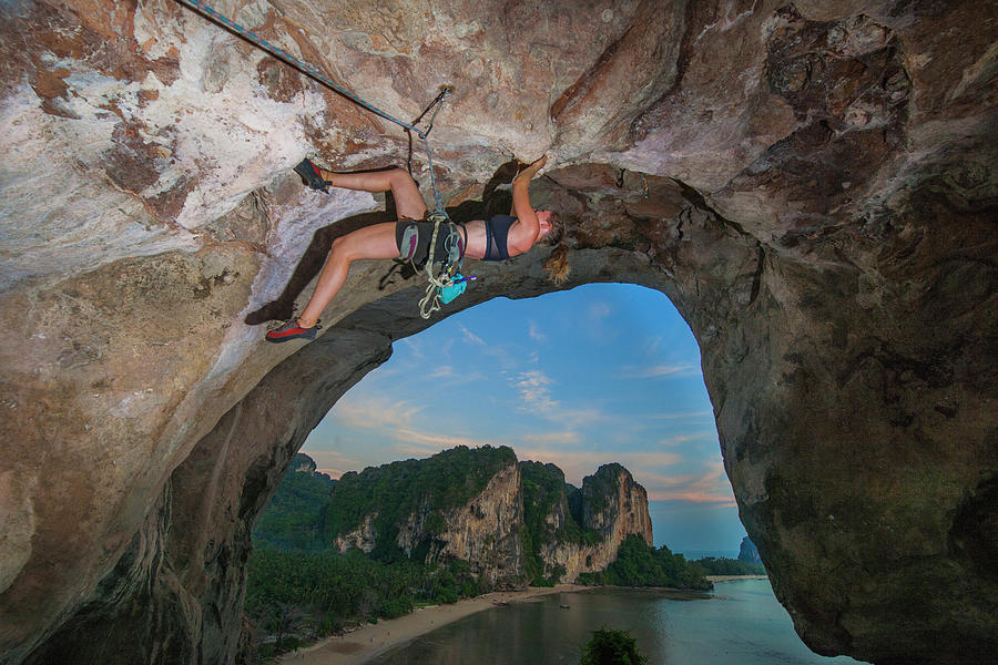 Young Woman Climbing Overhanging Rock Face At Tonsai Beach Photograph ...