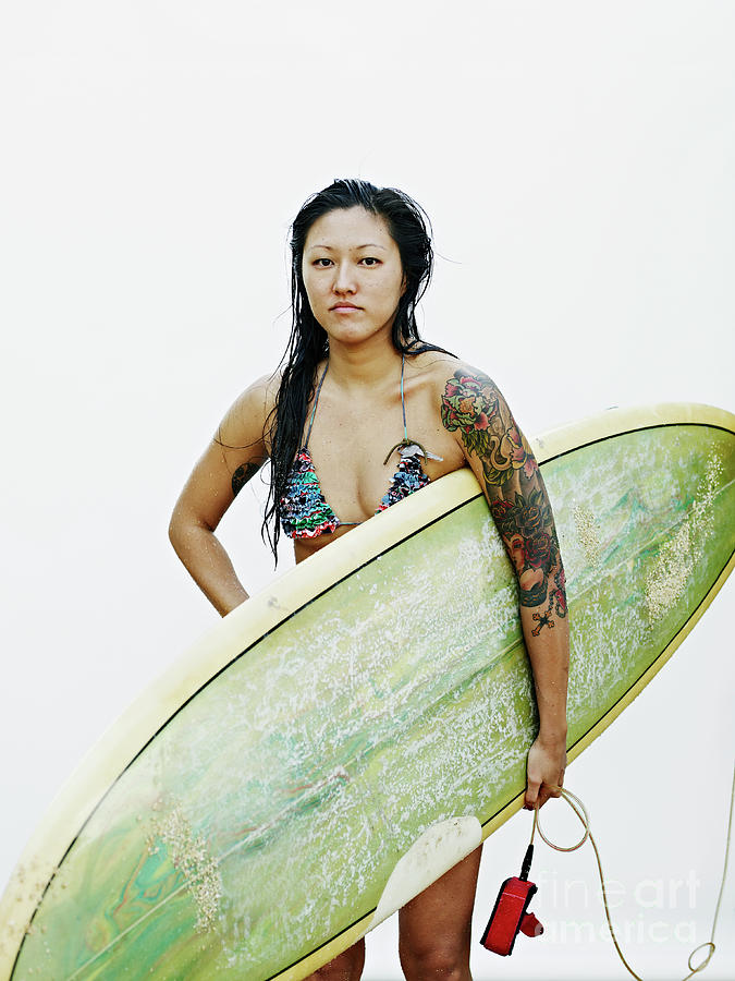 Young Woman Holding Surfboard Photograph by Thomas Barwick