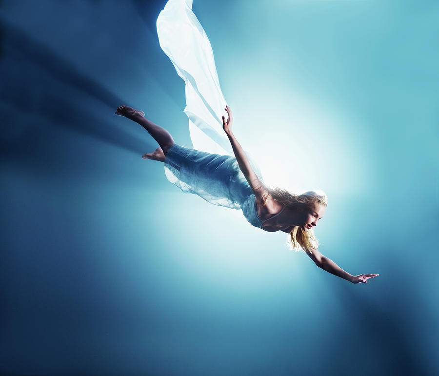 Young Woman In Air, Low Angle View Photograph by Henrik Sorensen