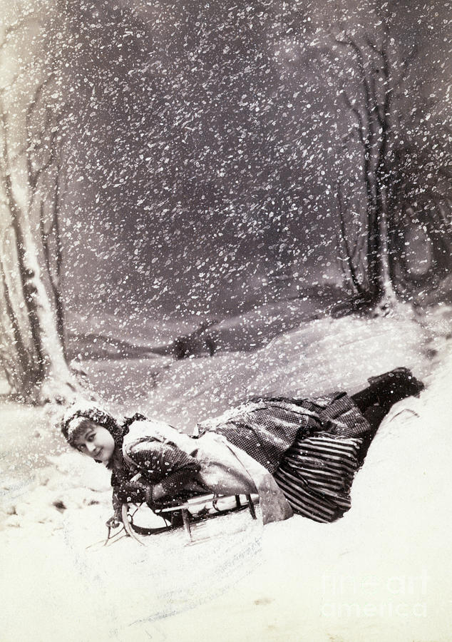 Young Woman Snow-sledding Photograph by Bettmann