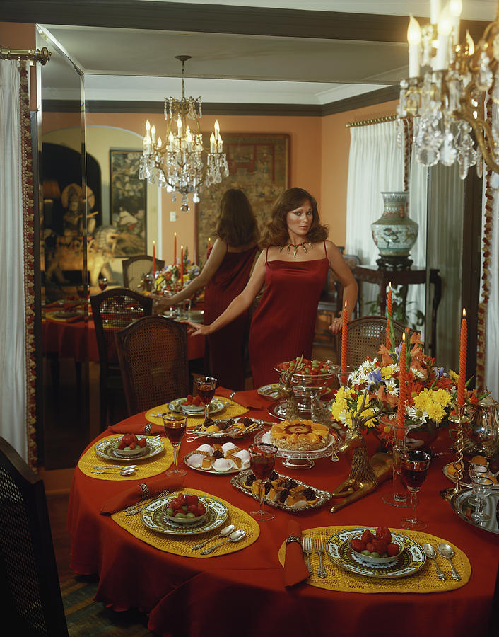 Young Woman Standing Beside Dining Photograph by Tom Kelley Archive