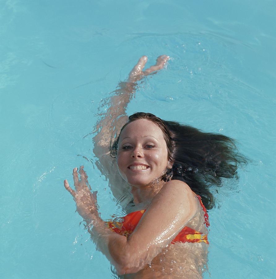 Young Woman Swimming In Pool, Portrait Photograph by Tom Kelley Archive