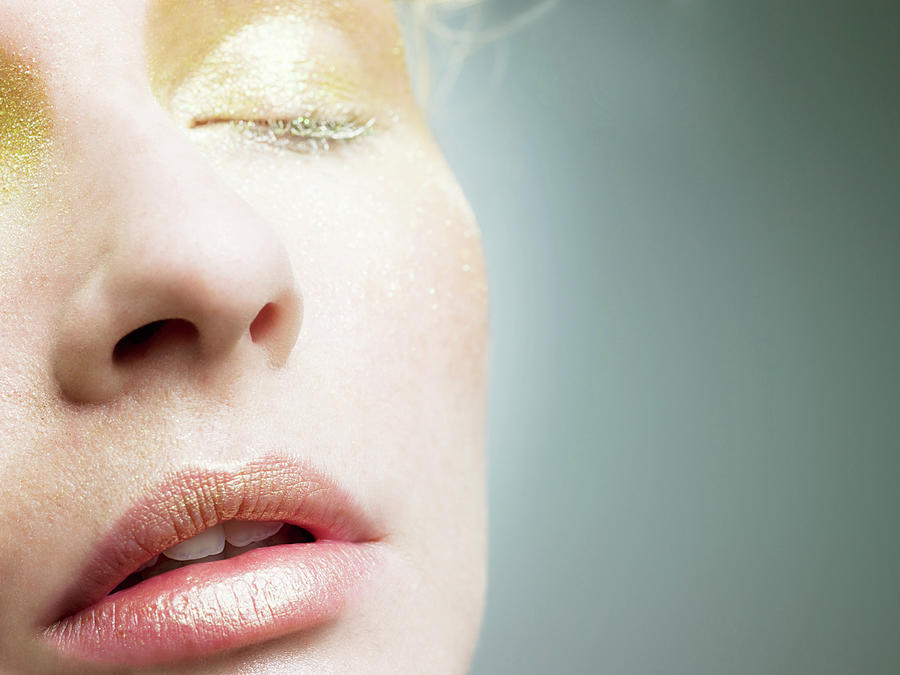 Young Woman With Gold Make Up On Face Photograph by Image Source