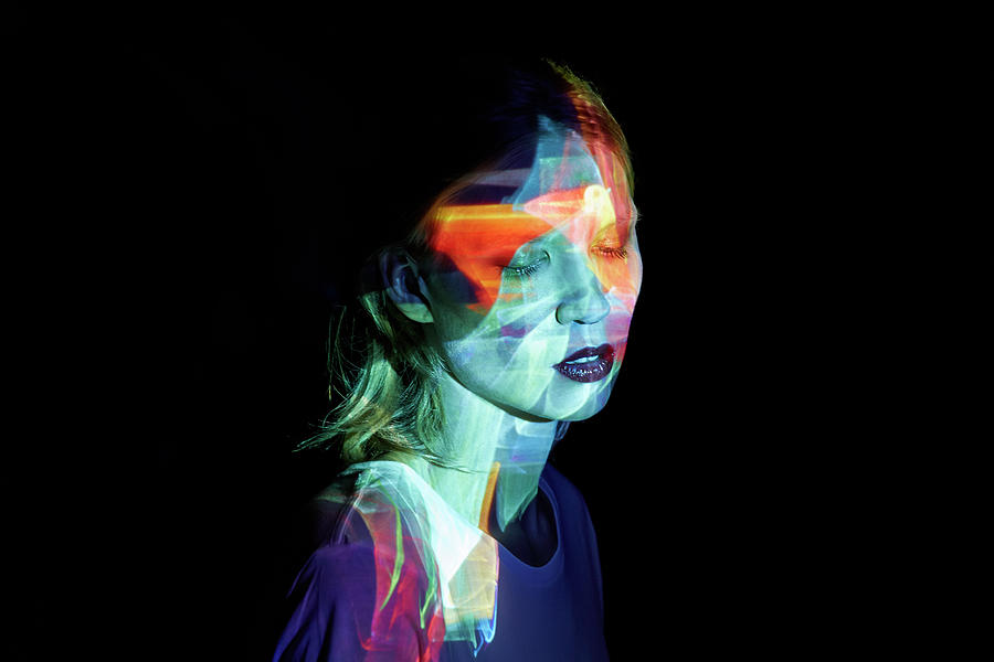 Young Woman With Multicolored Light In Photograph by Mads Perch