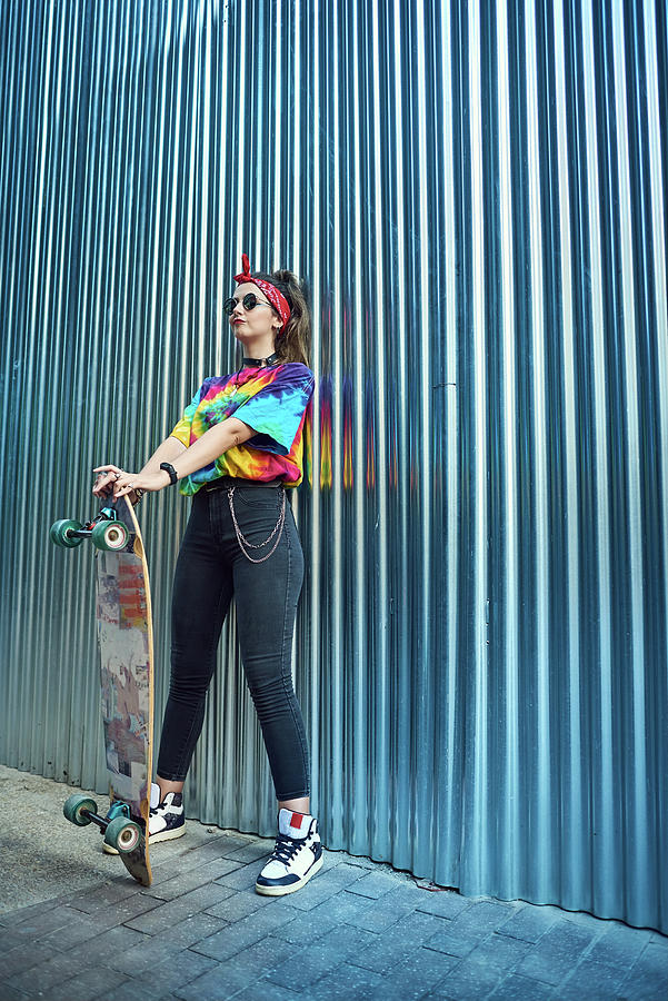 Sunset Photograph - Young Woman With Urban Style, She Poses With A Long Board. by Cavan Images