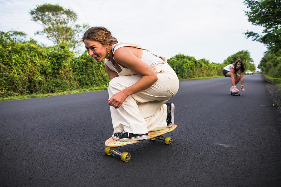 Nature Photograph - Young Women Skateboarding In Summer by Cavan Images