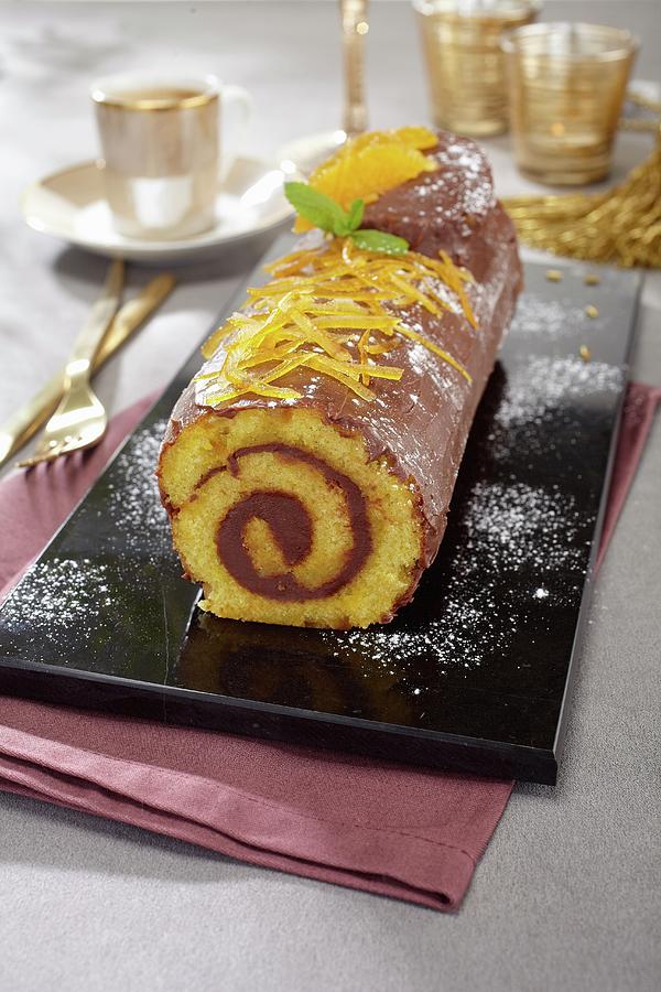 Yule Log With Oranges And Milk Chocolate Photograph by Alessandra Pizzi