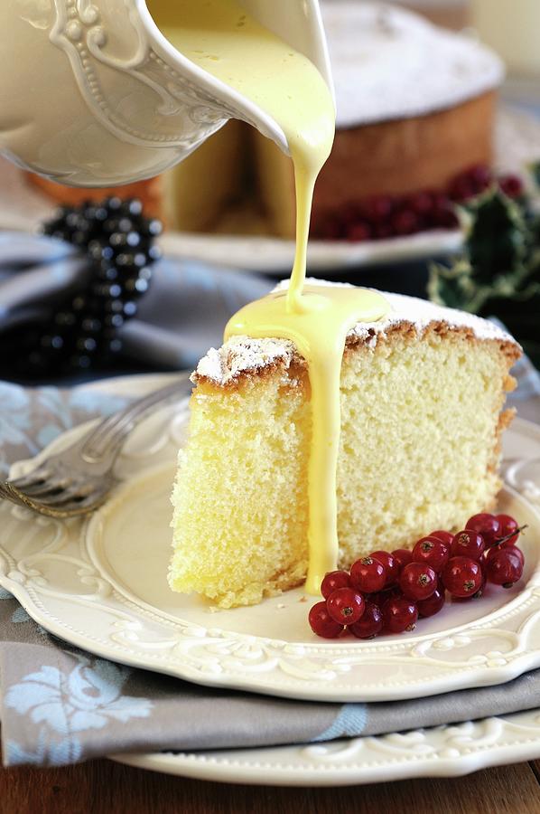 Zabaglione Sauce Being Poured Over A Slice Of Angel Food Cake Photograph by Mario Matassa