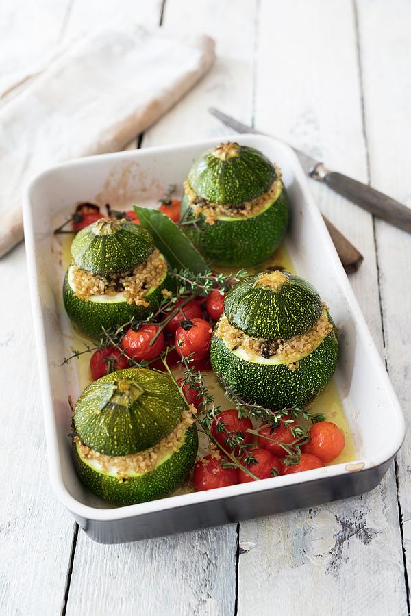Zucchini Filled With Quinoa And Cherry Tomatoes Photograph by Jan Wischnewski