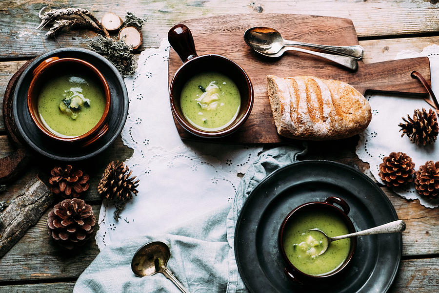 Zucchini Soup In 3 Bowls On A Wooden Table With Autumn Decorations From The Wood Photograph by Lucie Beck