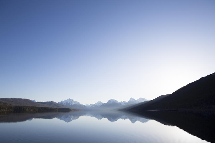 A calm morning before sunrise on Lake McDonald in Glacier National Park. #1 Photograph by Craig Moore