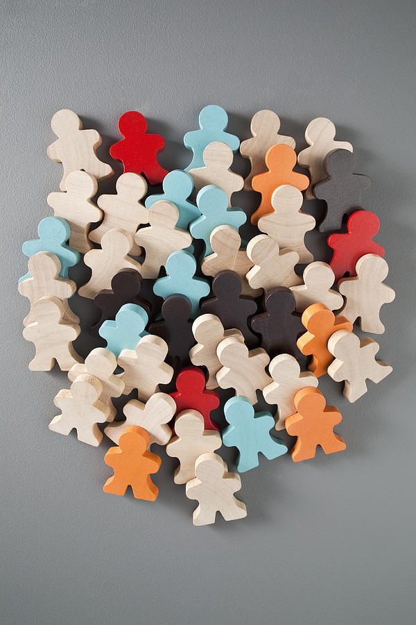 A group of multi colored wooden stick figures #1 Photograph by Charles Orr