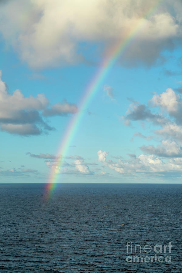 A rainbow appears over the Caribbean near the island of Saint Ma #1 Photograph by William Kuta
