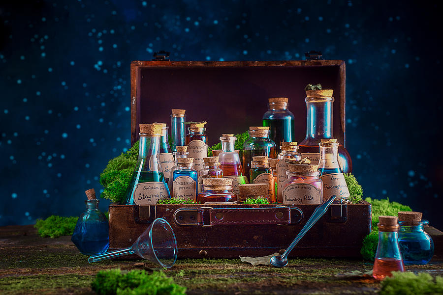A suitcase full of potions and remedies for inspiration, motivation and productive work. Modern witch concept with copy space. #1 Photograph by Dina Belenko Photography