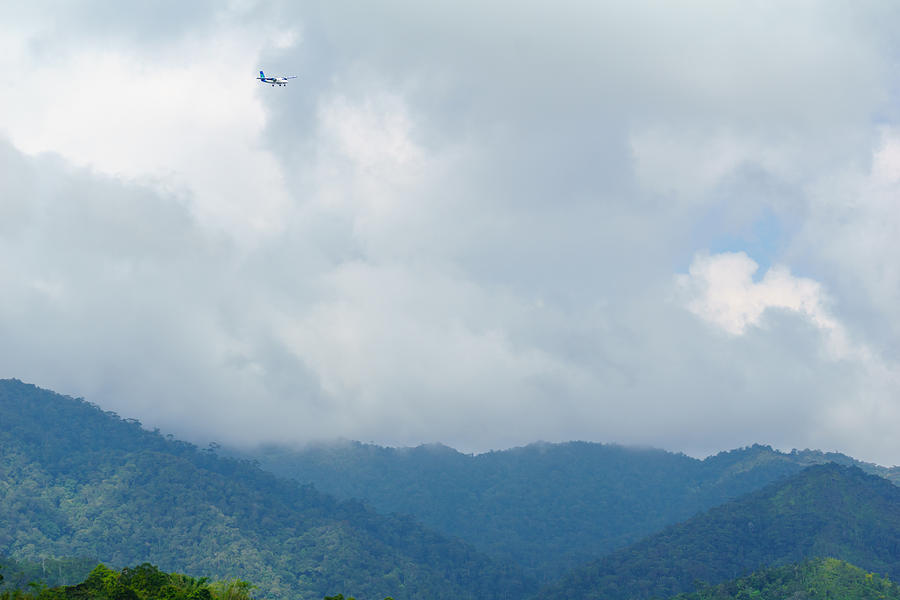 A twin otter aircraft from Malaysia Airlines over Bario highland area. The flight will took 1 hour compared to 11 hours by land from Miri due to rural road condition. #1 Photograph by Shaifulzamri