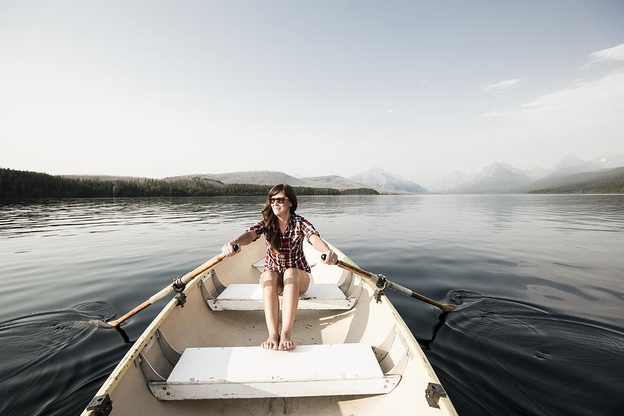 A woman in a row boat. #1 Photograph by Jordan Siemens