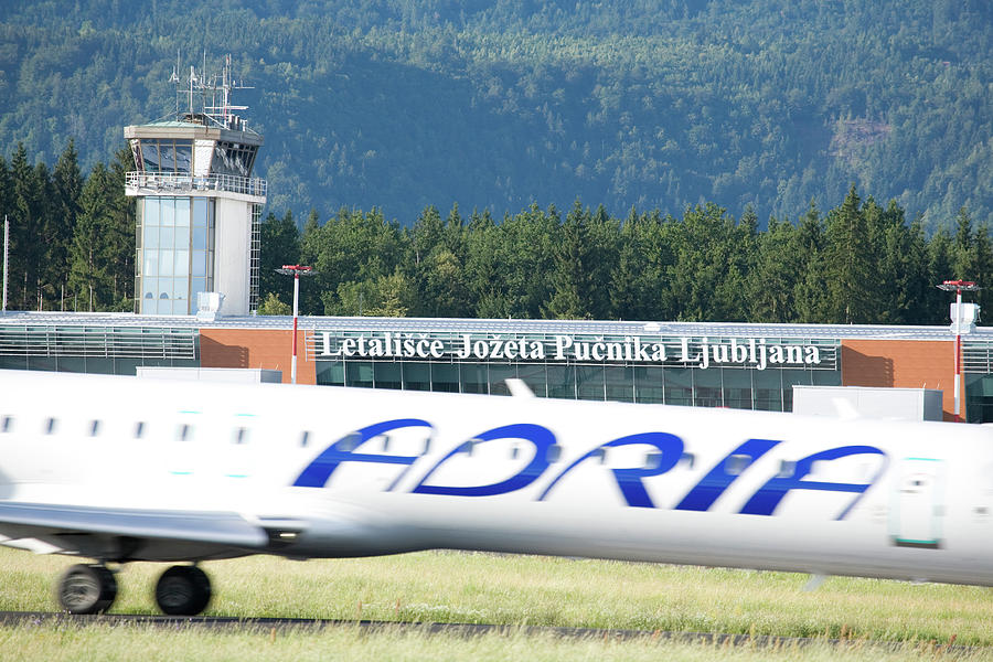 Adria airplane preparing to take off from Ljubljana Joze Pucnik  #1 Photograph by Ian Middleton