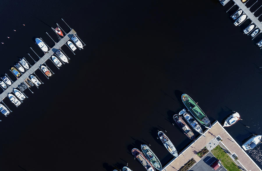 Aerial drone scenery of fishing boats and tourist yachts moored  #2 Photograph by Michalakis Ppalis